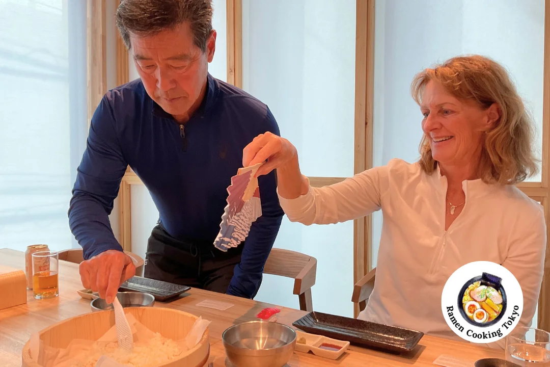 Couple preparing sushi rice together, sharing a loving moment