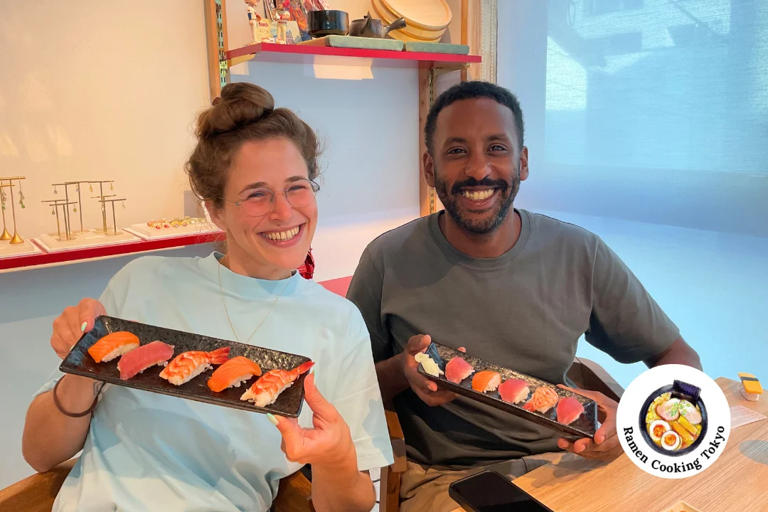 Young couple with their completed sushi plate