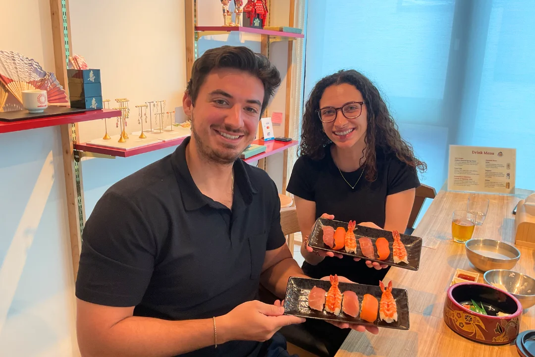 Learning to shape nigiri sushi by hand — a moment of focus and care in a Tokyo cooking class