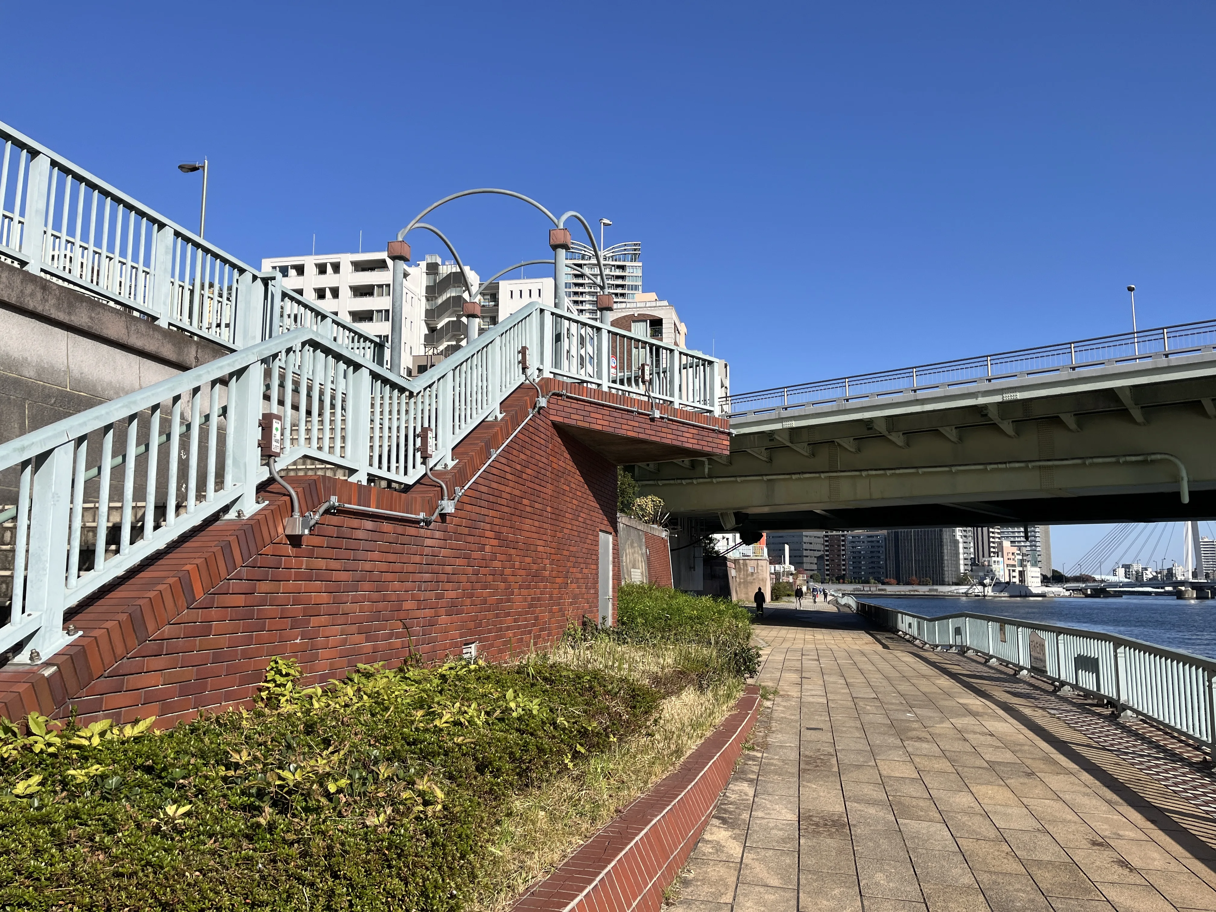 Charming red brick stairs leading to Tsukuda Ohashi Bridge