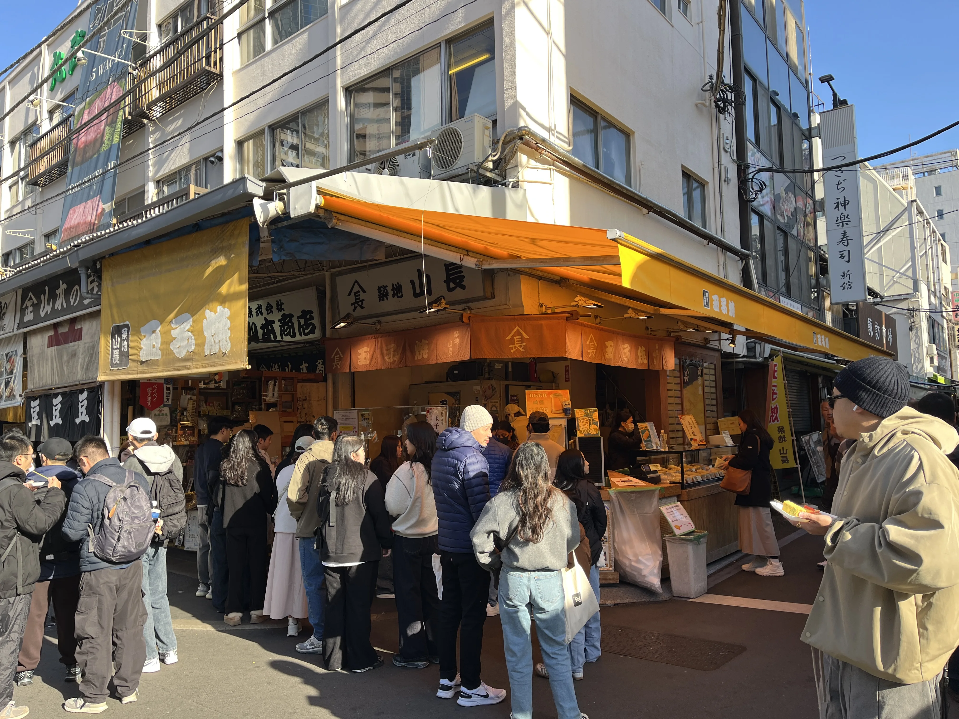Famous Yamacho Tamagoyaki shop with its bright yellow storefront